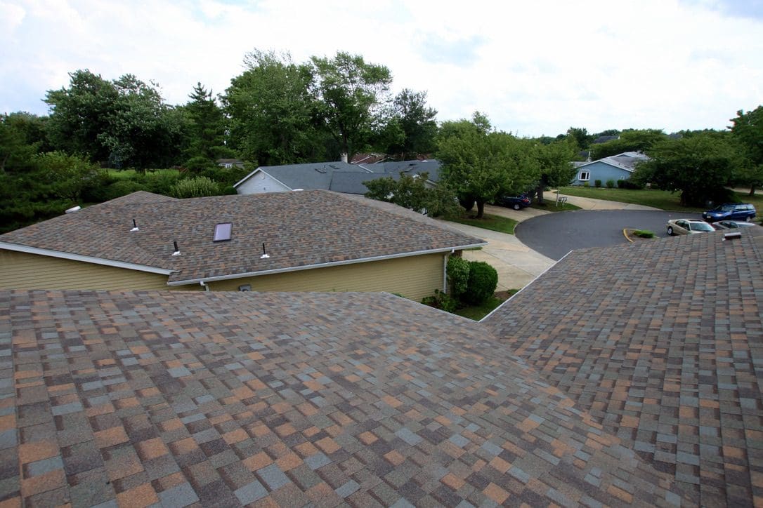 A view of houses from the roof of a house.
