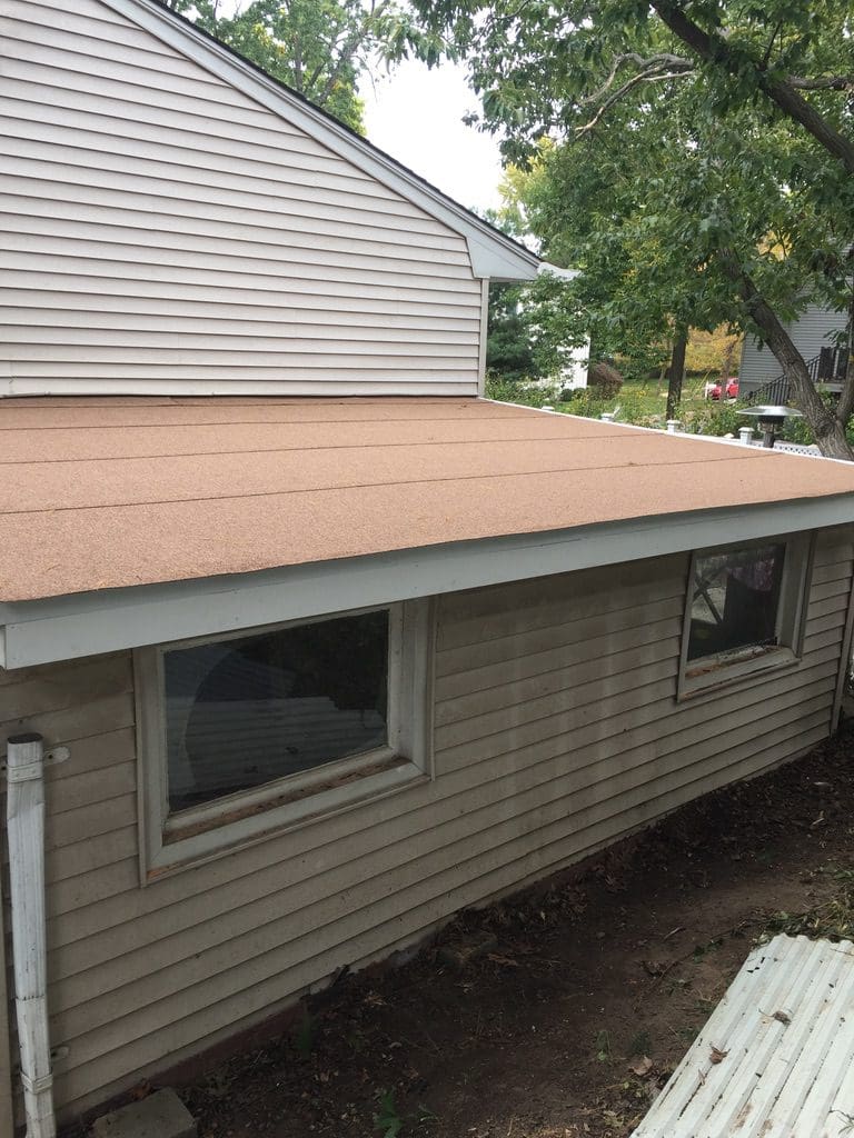 A house with a roof that has been installed.