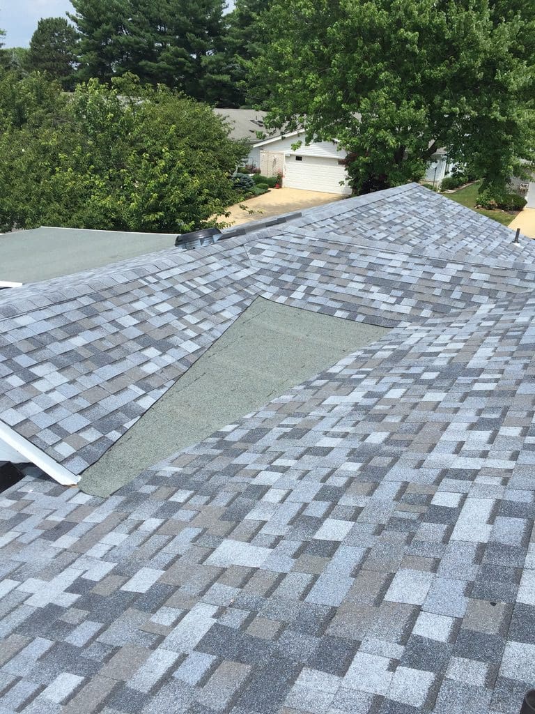 A roof that has been shingles removed.