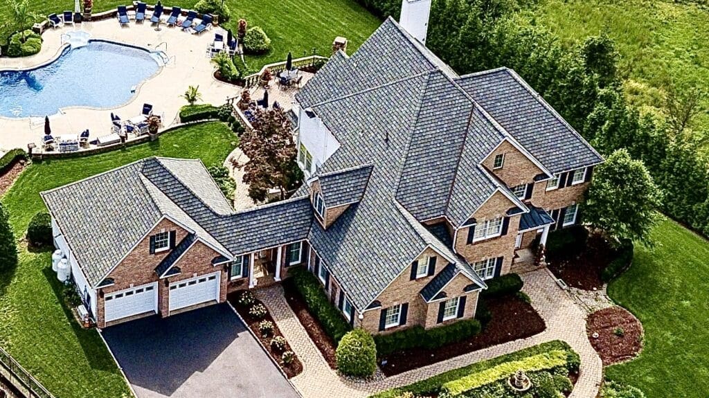 new jersey residential roofing. Arial view of large house with beautiful roof. grand manor luxury nj roofing installation