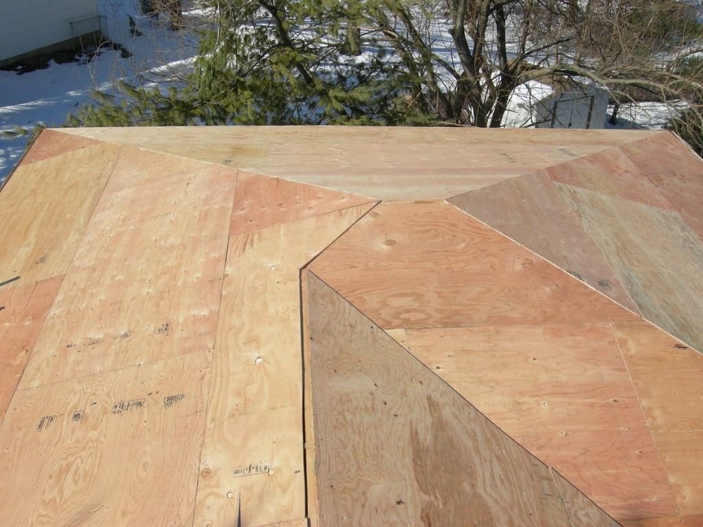 a roof covered with brand new plywood.