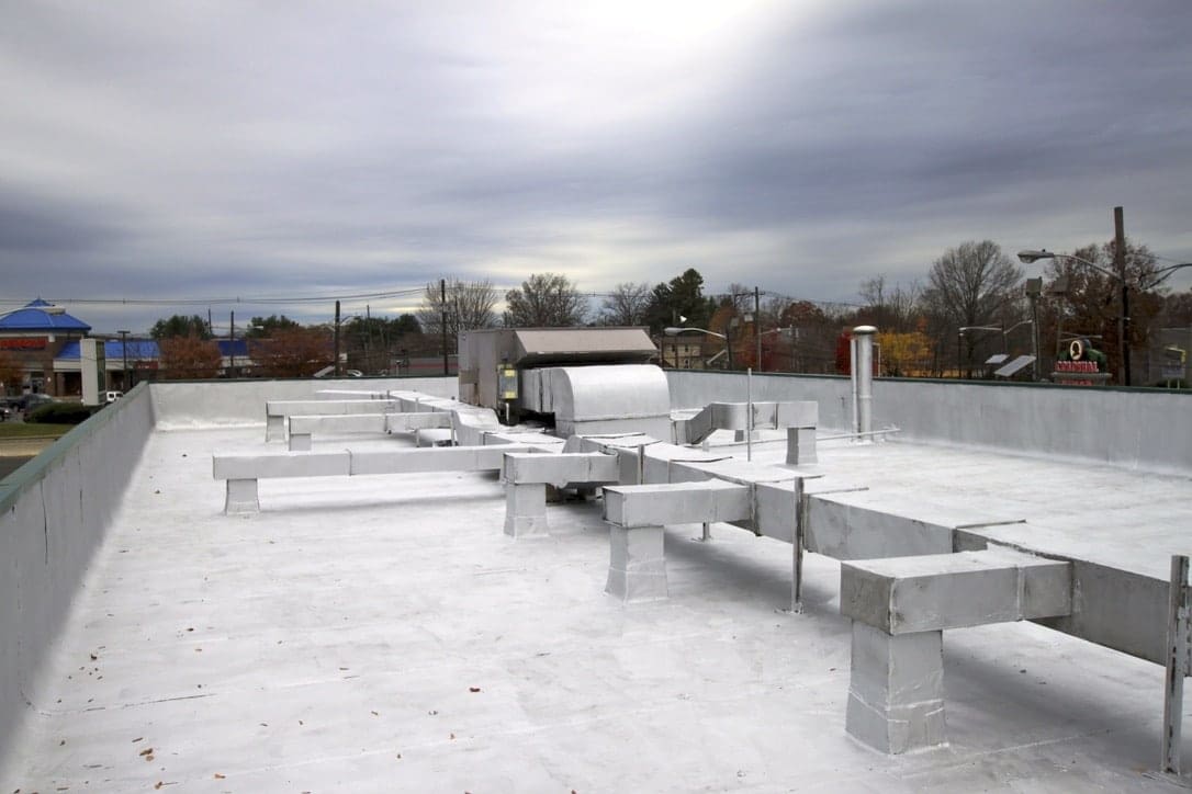 A large flat roof with many venting structures.