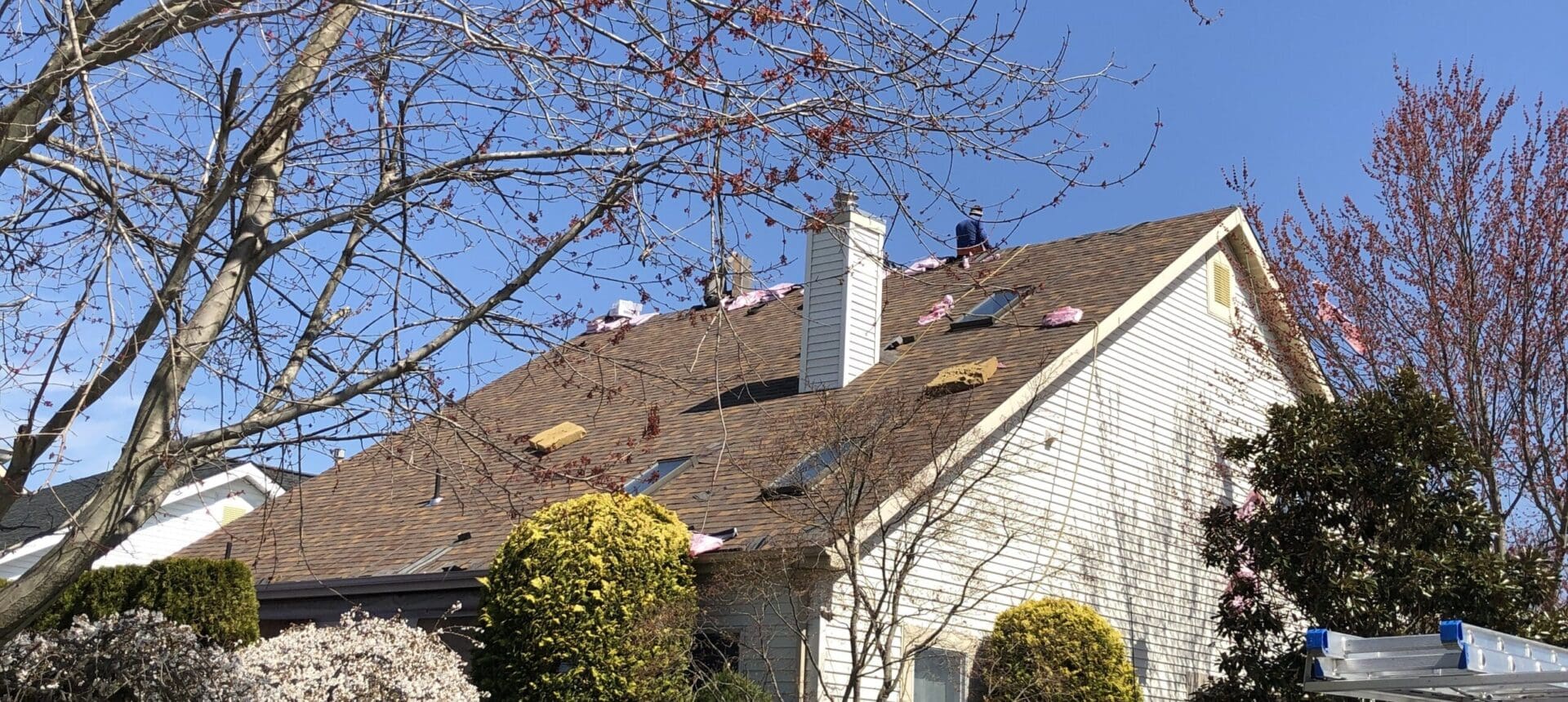 A house with a bunch of shingles on the roof