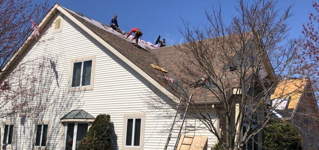 3 men working on a roof NJ east brunswick Roof Repair Service
