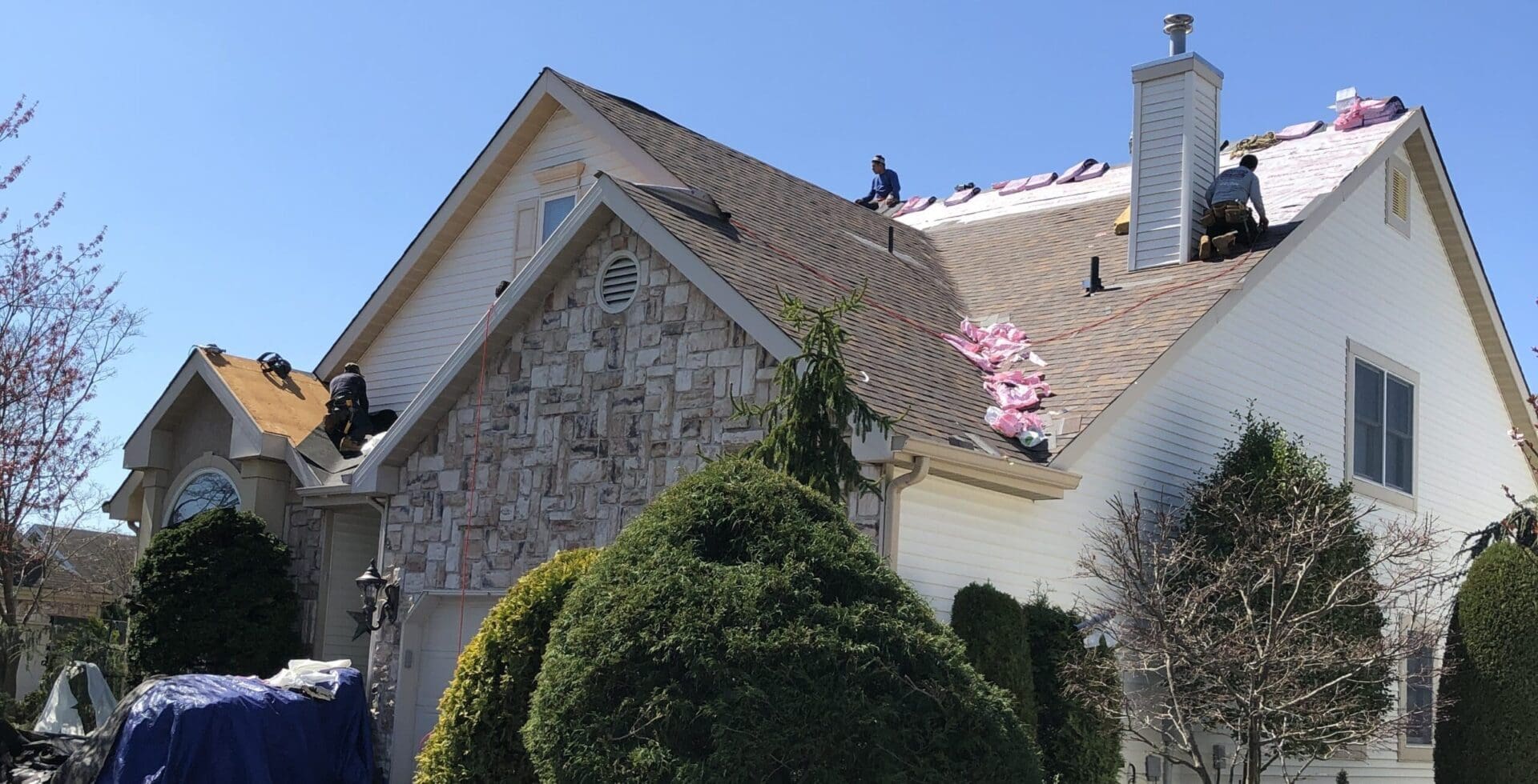 A person standing on top of a roof.