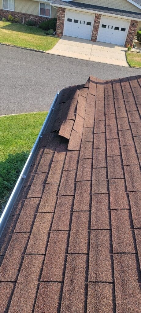 A close up of the roof of a house, consult certified NJ ROOF REPAIR SERVICES