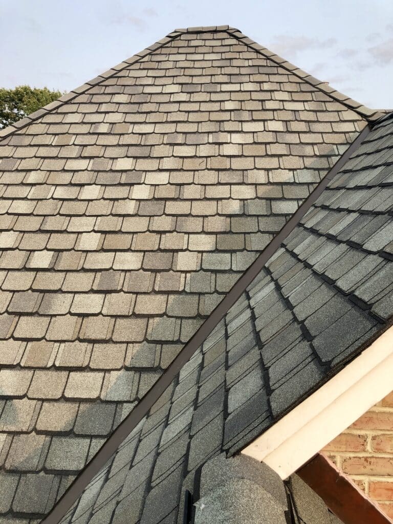 A close up of the roof of a house New Jersey residential roofing-kynar steel W Flashed Open Valley